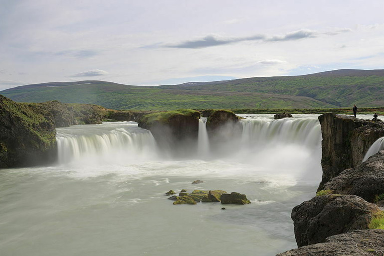 elegant arc of a waterfall marks a religious turning point