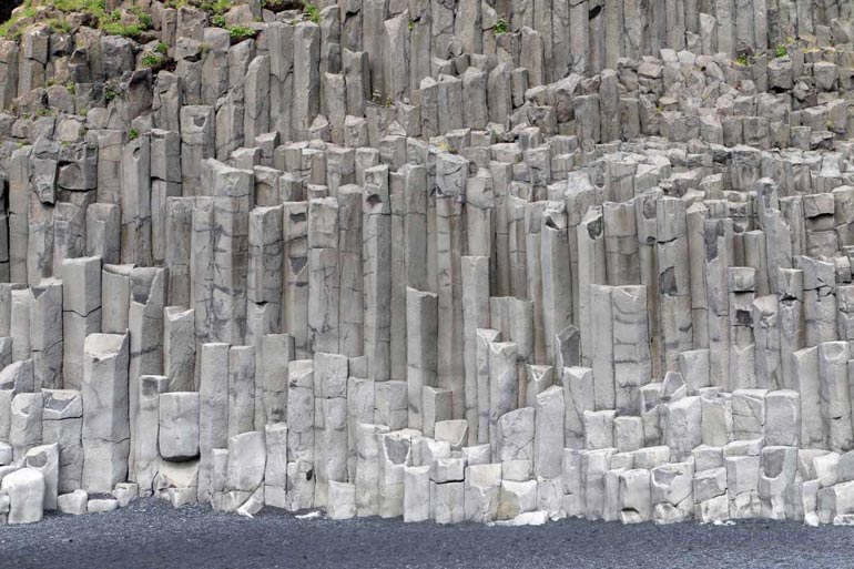 Stuðlaberg basalt columns on Reynisfjara beach near Vik